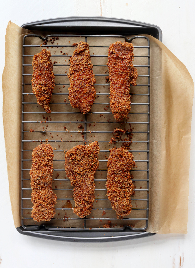 Baked Pecan Crusted Chicken Tenders are a fun (and healthy) twist on a traditional American classic. A prep-ahead option and short ingredient list make this the perfect weeknight meal.