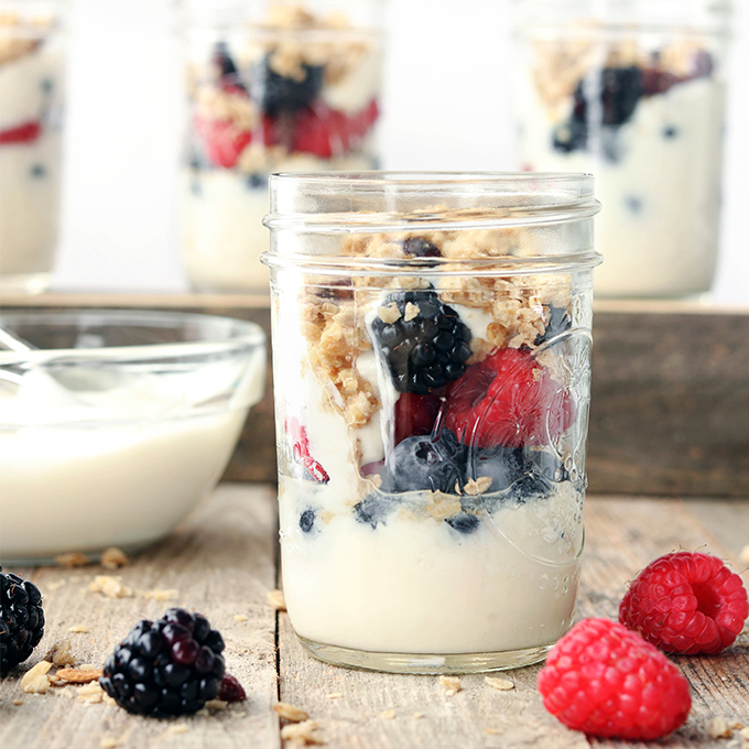 These Triple Berry Yogurt Parfaits are simple, requiring just 4-ingredients and come together in about 5 minutes. Easy, grab-n-go jars of perfection with honey, yogurt, berries and granola.