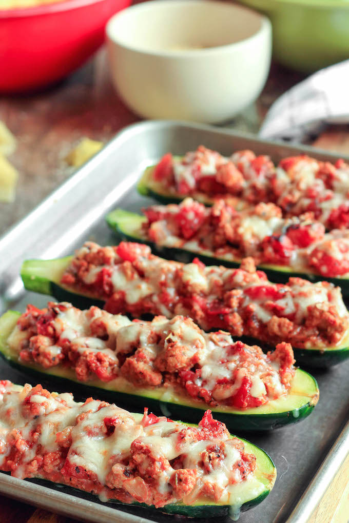 Lasagna stuffed zucchini boats are simple to make, requiring just 30 minutes. Tender zucchini hollowed out and stuffed with layers of creamy ricotta cheese, Italian meat sauce and melty mozzarella cheese.