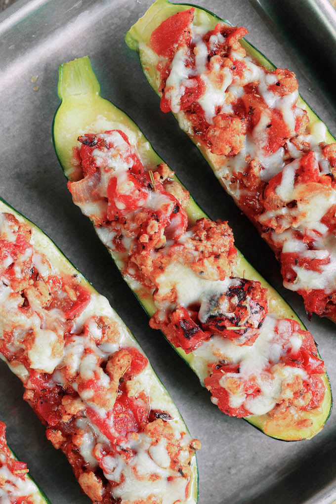Lasagna stuffed zucchini boats are simple to make, requiring just 30 minutes. Tender zucchini hollowed out and stuffed with layers of creamy ricotta cheese, Italian meat sauce and melty mozzarella cheese.