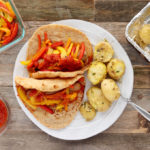 Italian Sausage Gyros are simple to make, requiring just 10 minutes hands on prep. Spicy Italian Chicken Sausage, tender roasted red bell peppers and sweet onions wrapped in a whole-wheat pita with melty mozzarella and marinara, sheet pan supper has never tasted better!