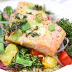 Lemon Herb Salmon El Papillote . A fast and healthy dinner loaded with fresh veggies and nutrient dense salmon. It cooks in it's own parchment paper pouch, so no dishes!
