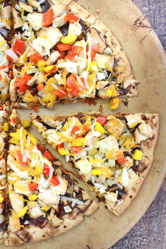 The best and easiest BBQ Chicken Pizza with a whole wheat crust, tangy bbq sauce, loads of seasoned chicken and melty cheeses too!