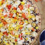The best and easiest BBQ Chicken Pizza with a whole wheat crust, tangy bbq sauce, loads of seasoned chicken and melty cheeses too!