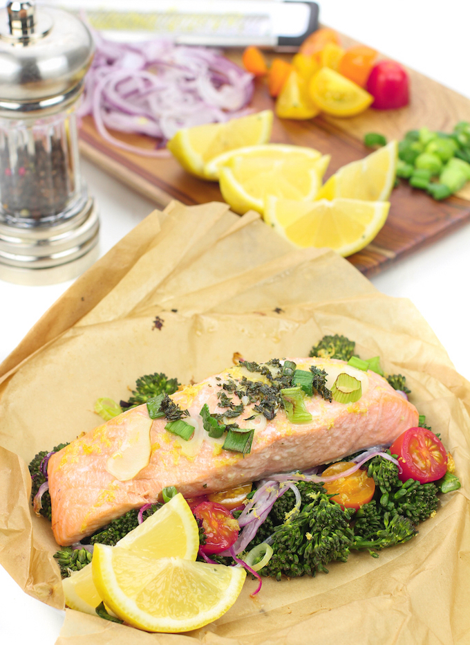 Lemon Herb Salmon El Papillote . A fast and healthy dinner loaded with fresh veggies and nutrient dense salmon. It cooks in it's own parchment paper pouch, so no dishes!