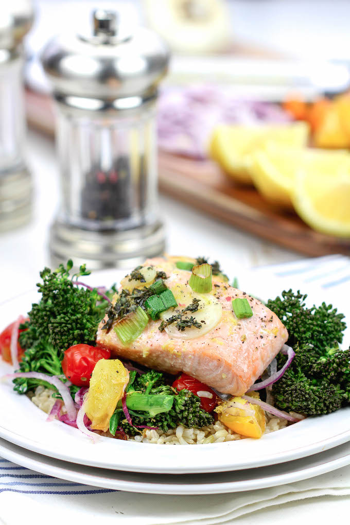 Lemon Herb Salmon El Papillote . A fast and healthy dinner loaded with fresh veggies and nutrient dense salmon. It cooks in it's own parchment paper pouch, so no dishes!