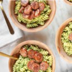 Winter Pesto Pasta with Italian Sausage in 3 wooden bowls.