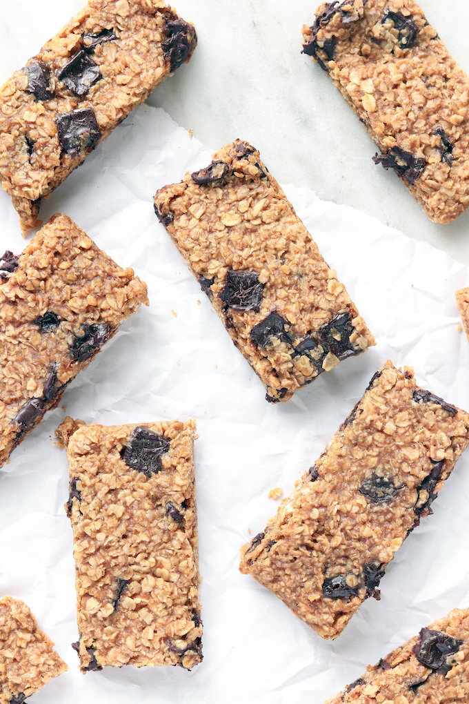 Peanut Butter Chocolate Protein Bars on white parchment paper.