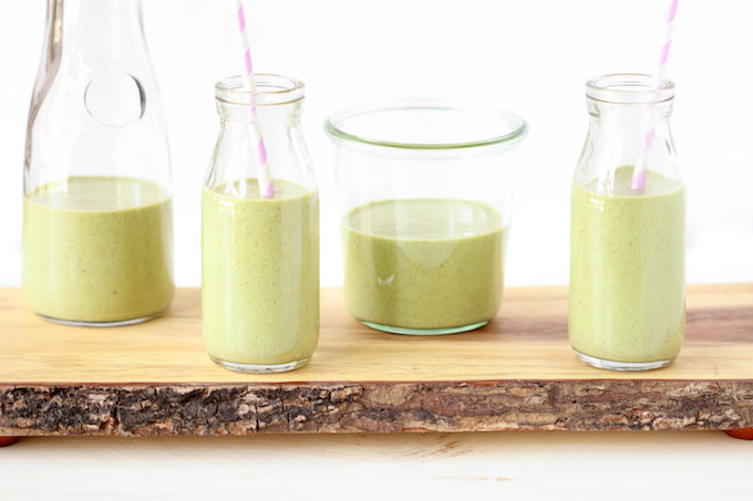 A cool, creamy, sweet vegan green smoothie with banana, peanut butter, kale, chia seeds, cinnamon and almond milk.