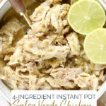 4-Ingredient Instant Pot Salsa Verde Chicken in a white bowl with a sliced lime for garnish.