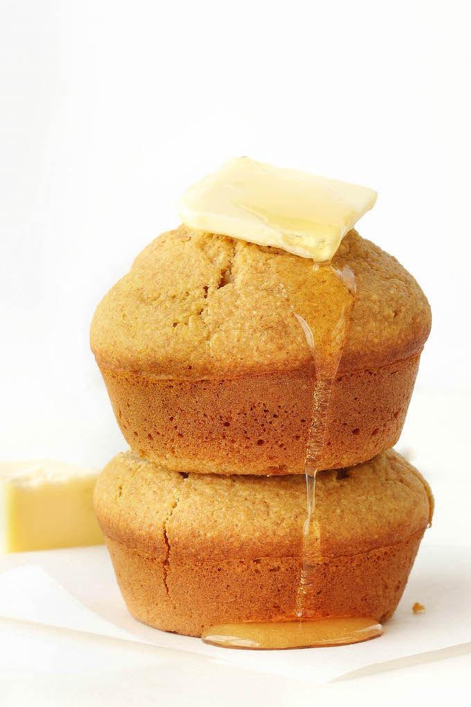 Easy, One-Bowl Corn Muffins sweetened naturally with honey. Tender, wholesome, and a delicious snack or side to savory entrees. #wholegrain 