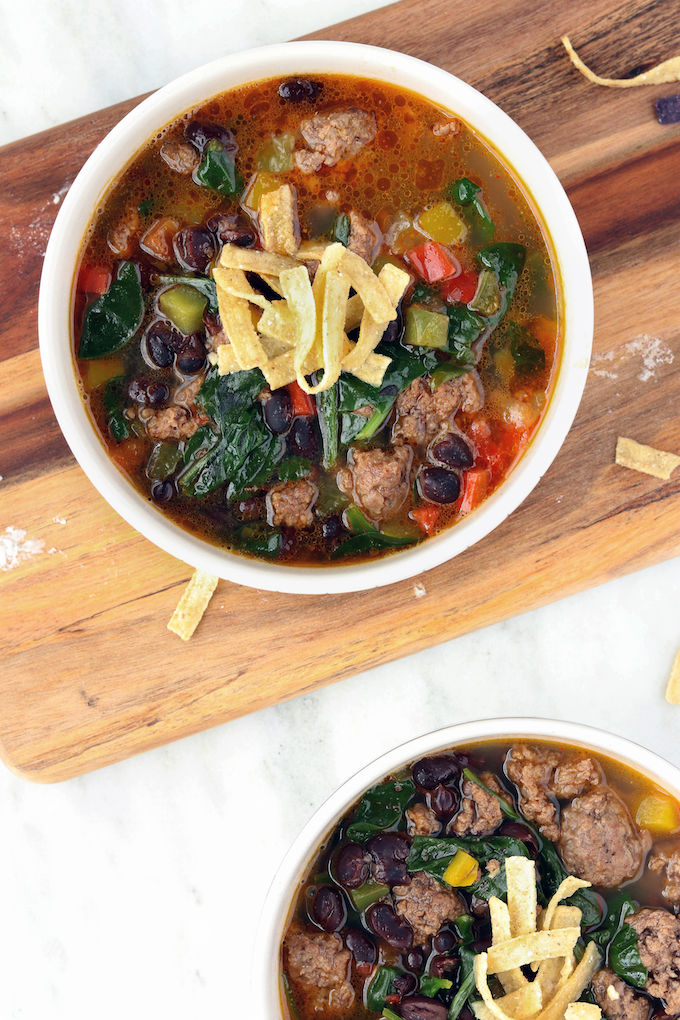 Simple, 30-minute Veggie Loaded Taco Soup is infused with tons of Mexican seasoning, black beans, bell peppers, and leafy greens. A hearty, nutrient dense, flavorful soup that's perfect for a 1-pot Winter meal.