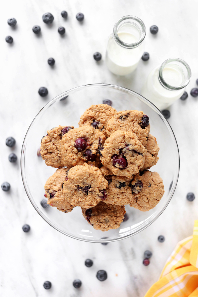 Blueberry and Almond Butter Breakfast Cookies on a glass cake pedestal.