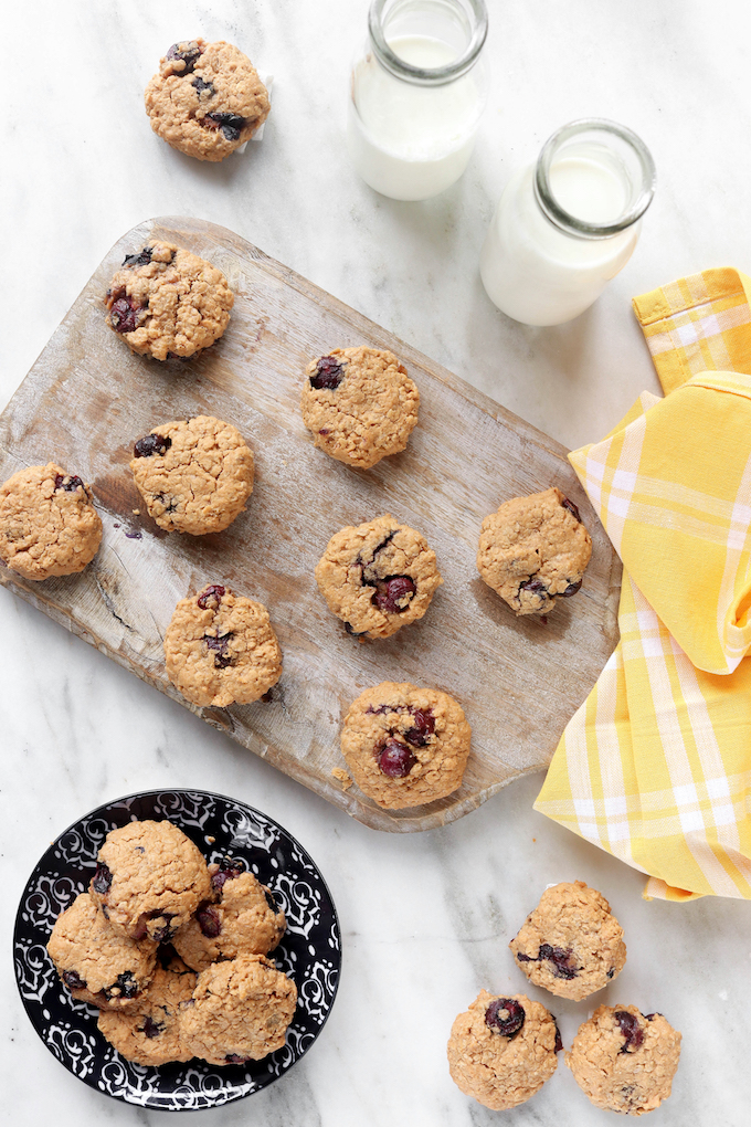 Blueberry and Almond Butter Breakfast Cookies on a wooden cutting board.