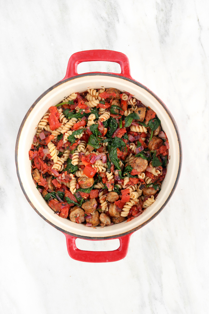 30- Minute Sausage Spinach Rotini Bake with caramelized onion, whole wheat pasta, perfectly seasoned fire roasted tomatoes and a golden cheese topping. Green, delicious, fresh and healthy!