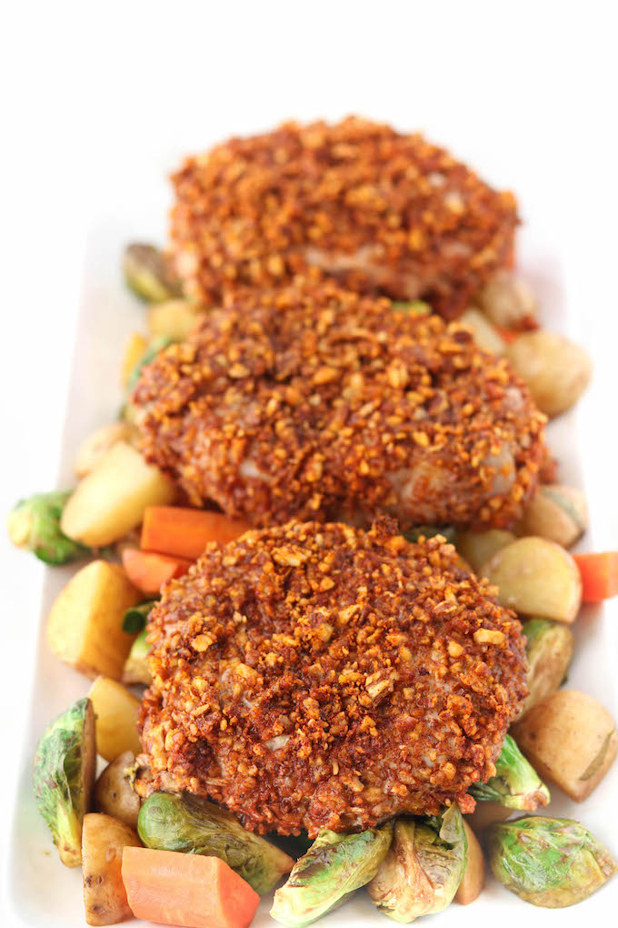 Sheet-Pan Pecan Crusted Pork Chops With Honey Balsamic Veggies is the perfect weeknight meal. 20 minutes hands on prep and dinner's done.
