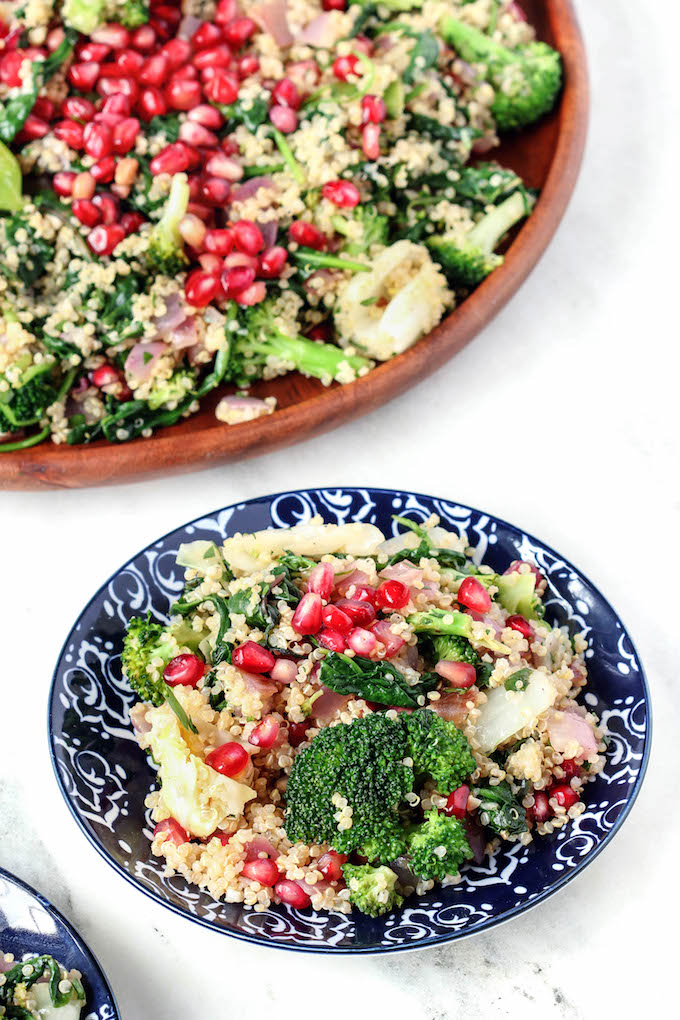 This warm Grains and Greens Detox Salad is simple to throw together and make ahead friendly. With tons of fresh greens, nutty quinoa, pomegranate seeds and a simple lemon vinaigrette..healthy has never tasted better!