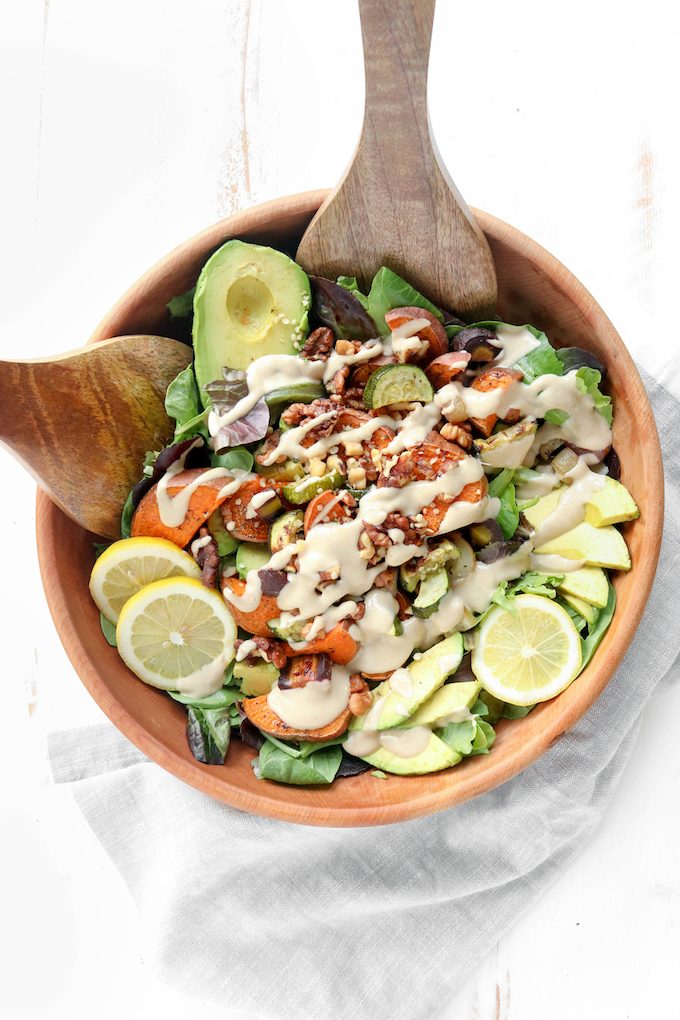 Simple, flavorful Lemon Tahini Bliss Bowls are an amazingly hearty with creamy avocados, perfectly roasted veggies, crispy walnuts and a creamy tahini-based dressing. A healthy plant-based meal.