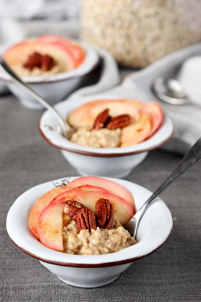 Simple, 20-minute, 7-ingredient Spiced Apple Pie Oatmeal is infused with pumpkin, cinnamon, coconut sugar, and a baked apple pecan topping!