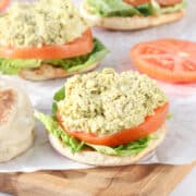 No Mayo Chicken Salad on an open faced English muffin topped with lettuce and tomato.