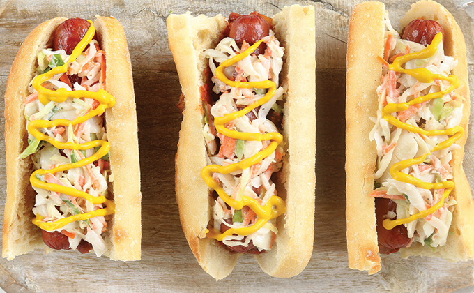 3 hotdogs with coleslaw, sloppy-joe and mustard topping.