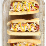 Sloppy Slaw Dogs are simple to make and perfect for a crowd. Classic Hotdogs topped with zesty Sloppy Joe, creamy Cole slaw and finished off with yellow mustard!