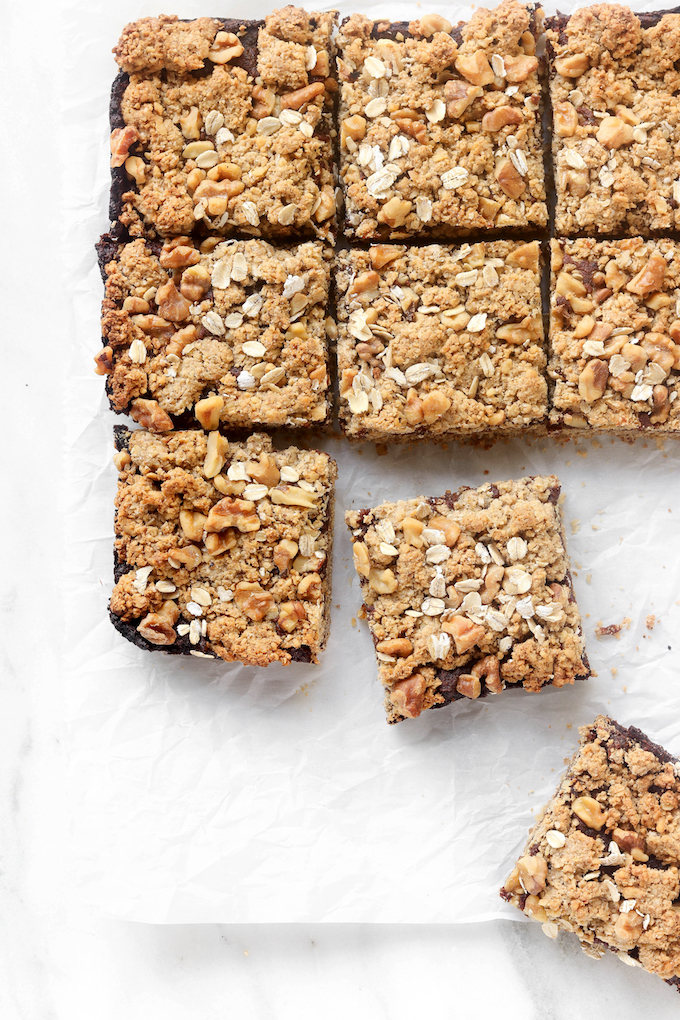 Black Cherry Walnut Bars sliced on parchment paper.