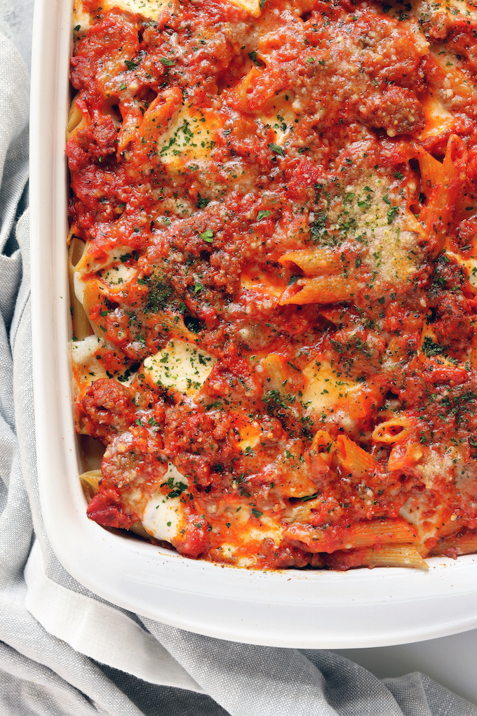 Cheesy Sausage Baked Penne is spicy, meaty, cheesy and make-ahead friendly. 6-Ingredients, 20 minutes prep and dinner is done.