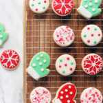 Naturally Dyed and Decorated Christmas Cookies on a cooling rack.