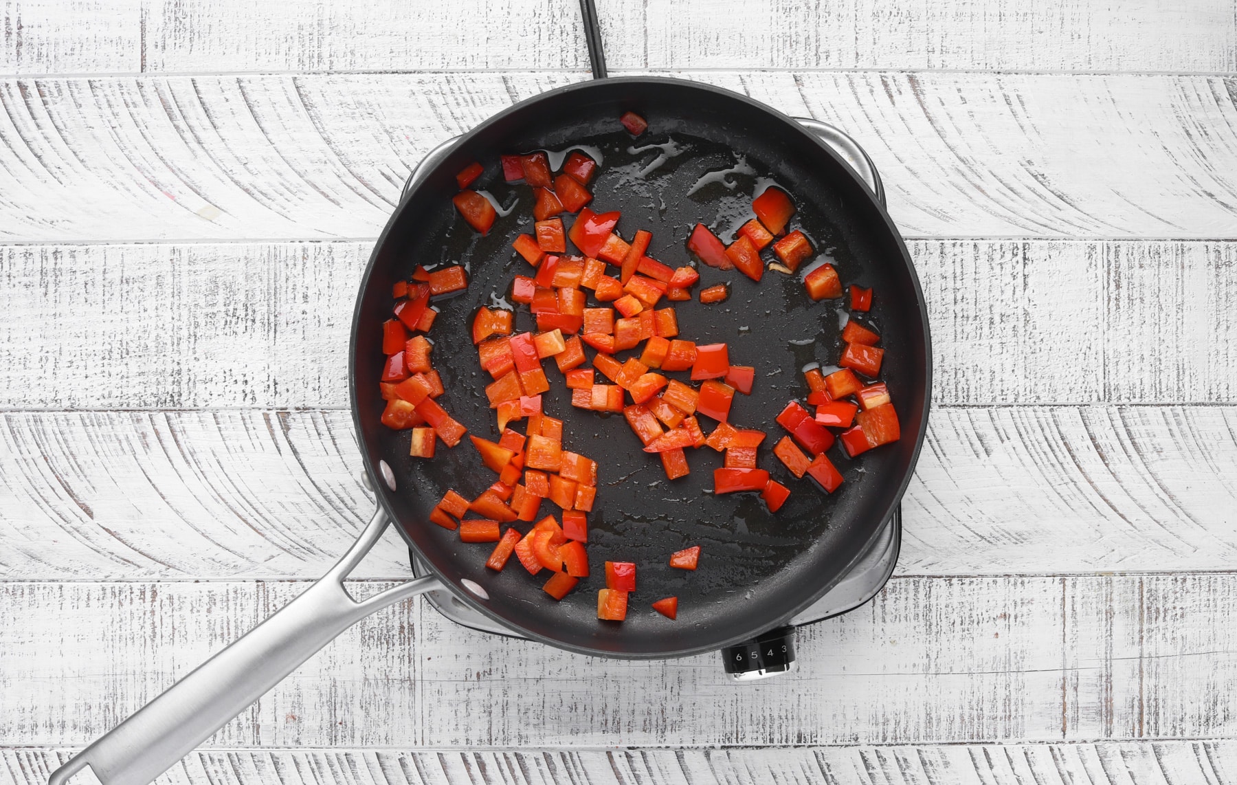 Step 1: Red peppers and olive oil in skillet.