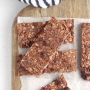 Peanut Butter Chocolate Protein Bars on a wood board.