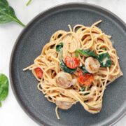 Gray plate piled high with chicken sausage pasta.