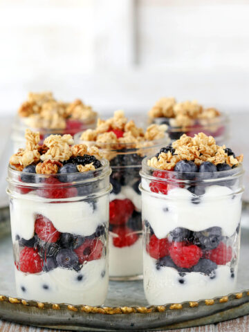 Make ahead fruit and yogurt parfaits on a silver tray.