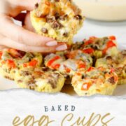 Baked Egg Muffin being lifted into the air from a white plate.