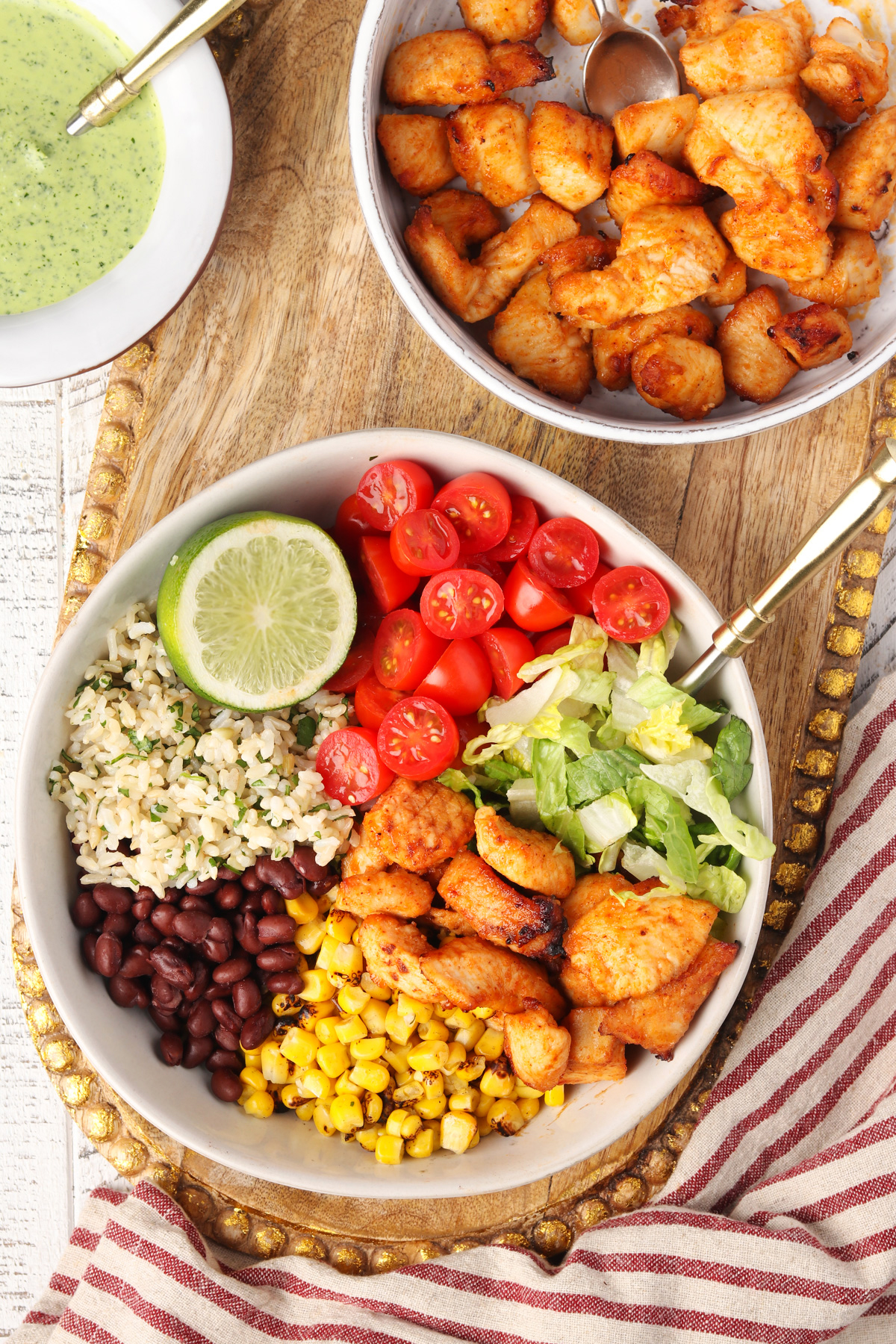 Healthy Burrito Bowl with cilantro lime dressing in a white bowl.