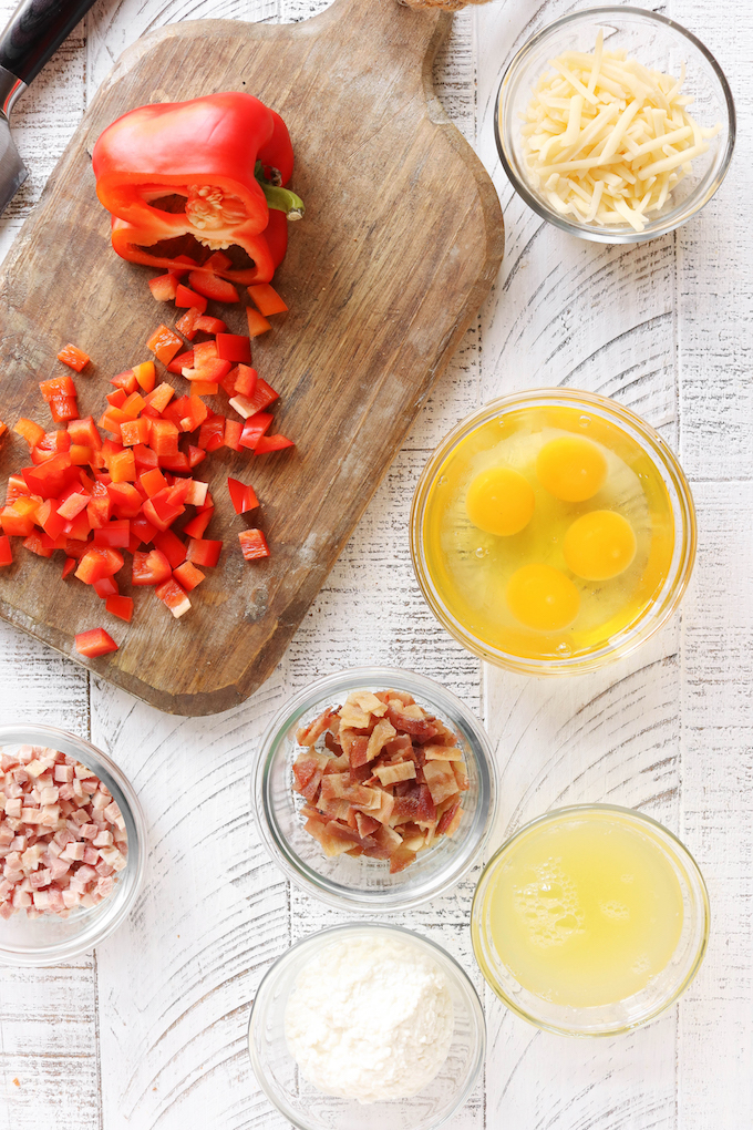 Instant Pot Egg Bite Ingredients: Red peppers, eggs, egg whites, bacon, ham, shredded cheese and cottage cheese.