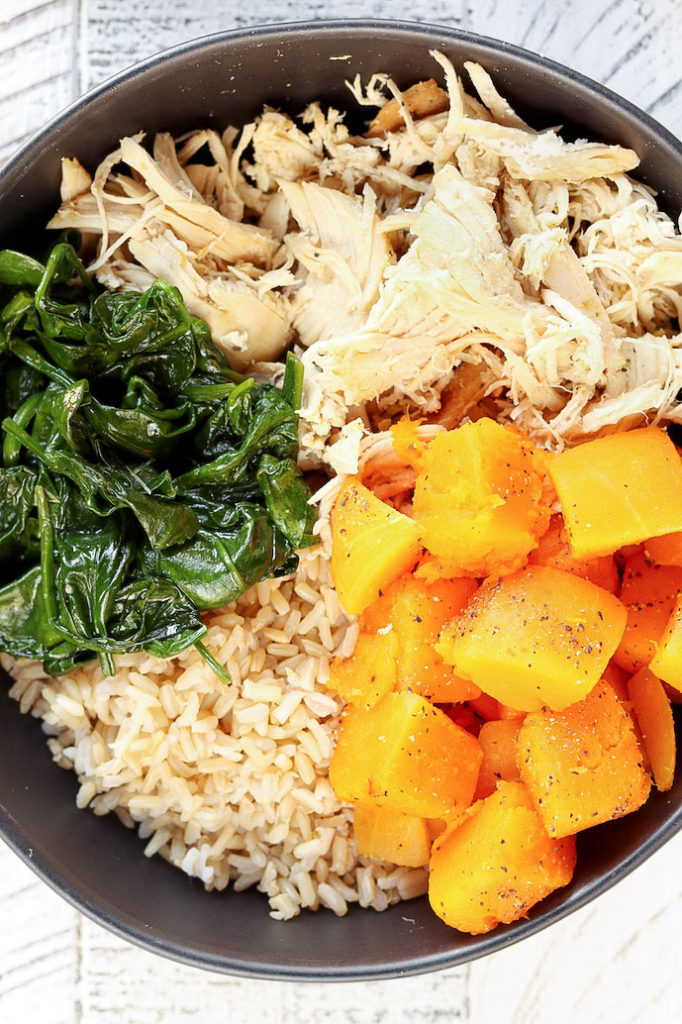 Honey-Lime Chicken Macro Bowl close view. Butternut squash, shredded chicken, sautéed spinach and brown rice.