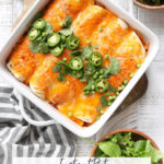 Easy Instant Pot Chicken Enchiladas garnished with jalapeños, green onions and cilantro.