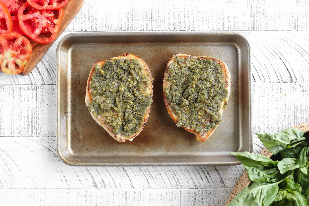 2 large chicken breasts topped with basil pesto.