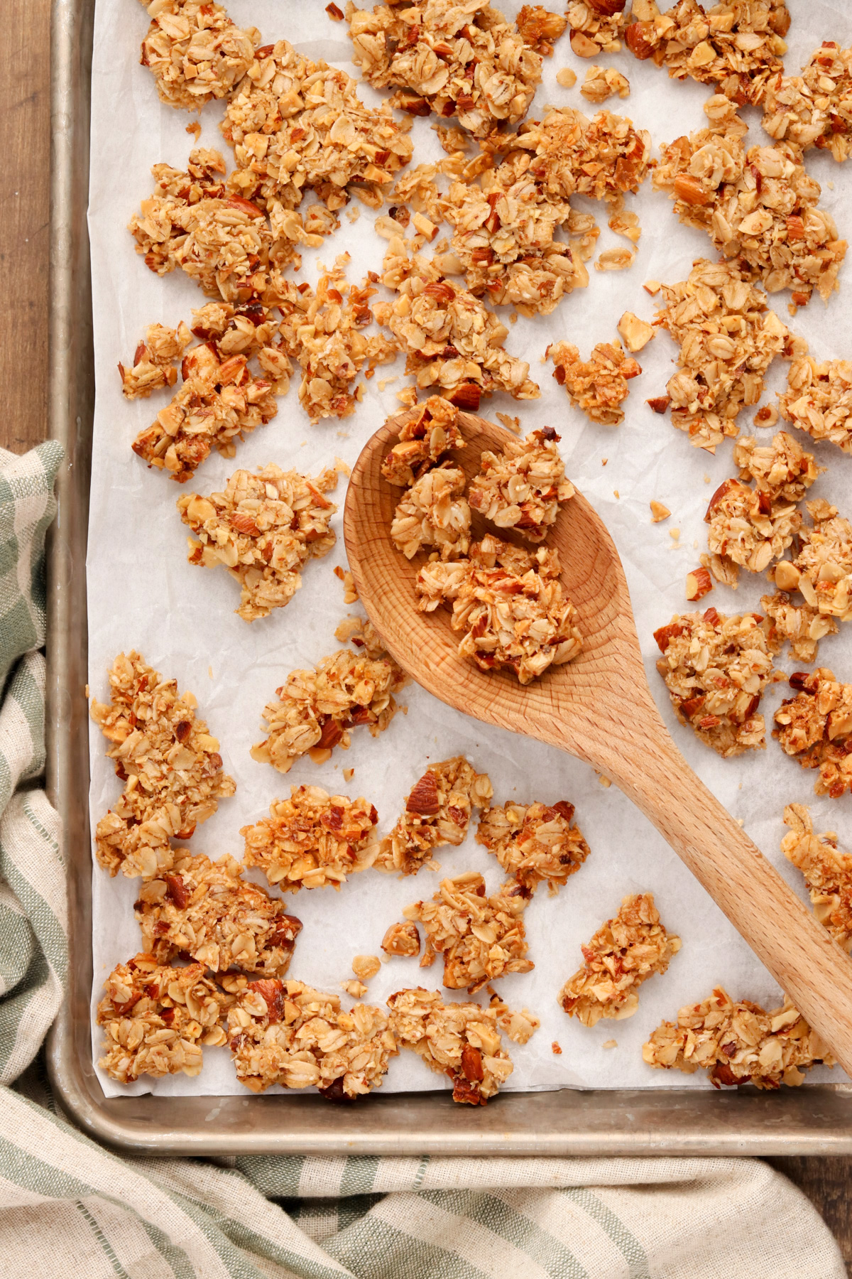 Quick Chunky Granola on a parchment covered sheet pan. 