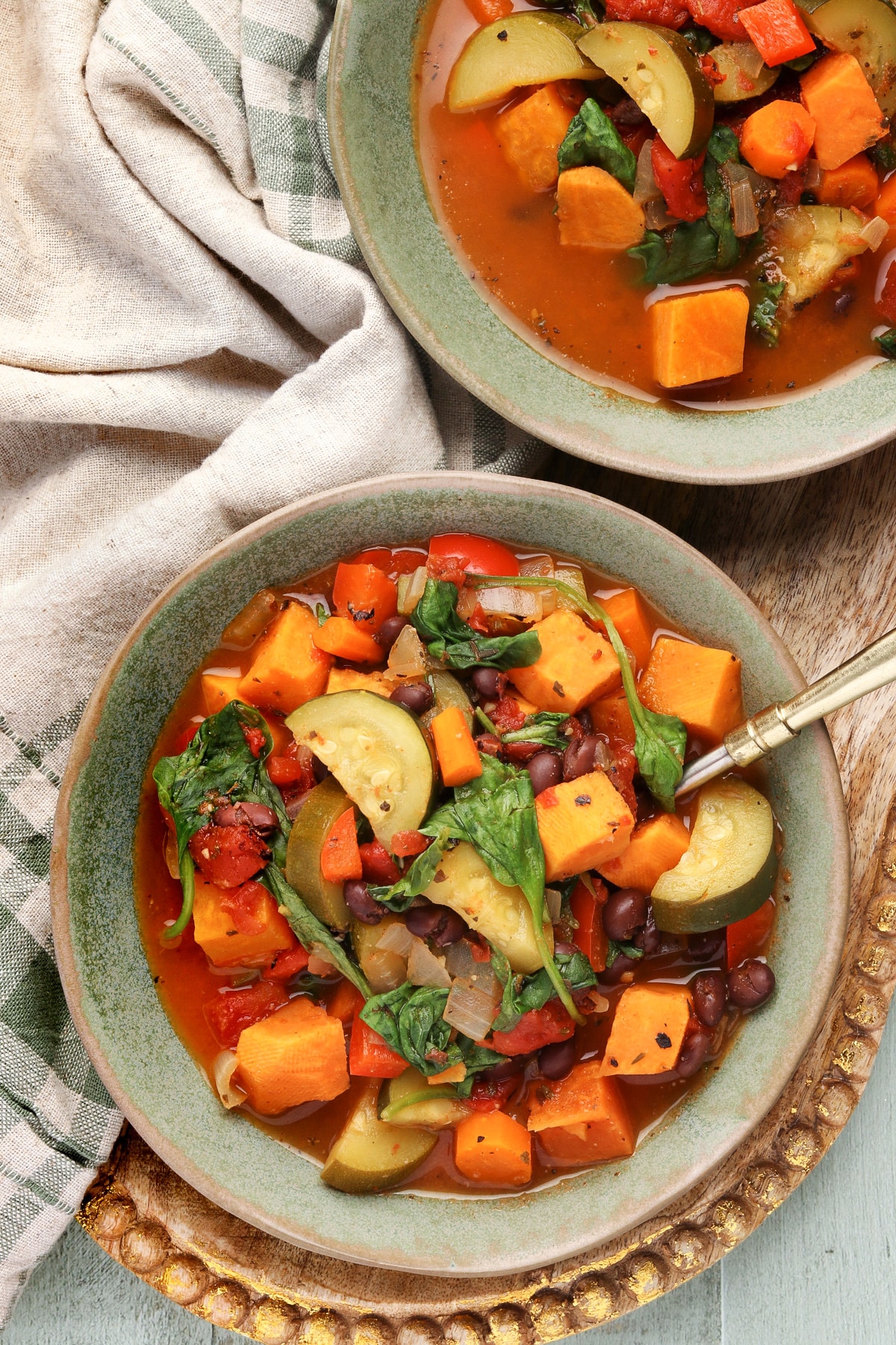 Thick and Chunky Vegetable Soup in a green bowl. 