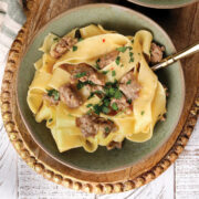 20 Minute Sausage Carbonara on a green plate.