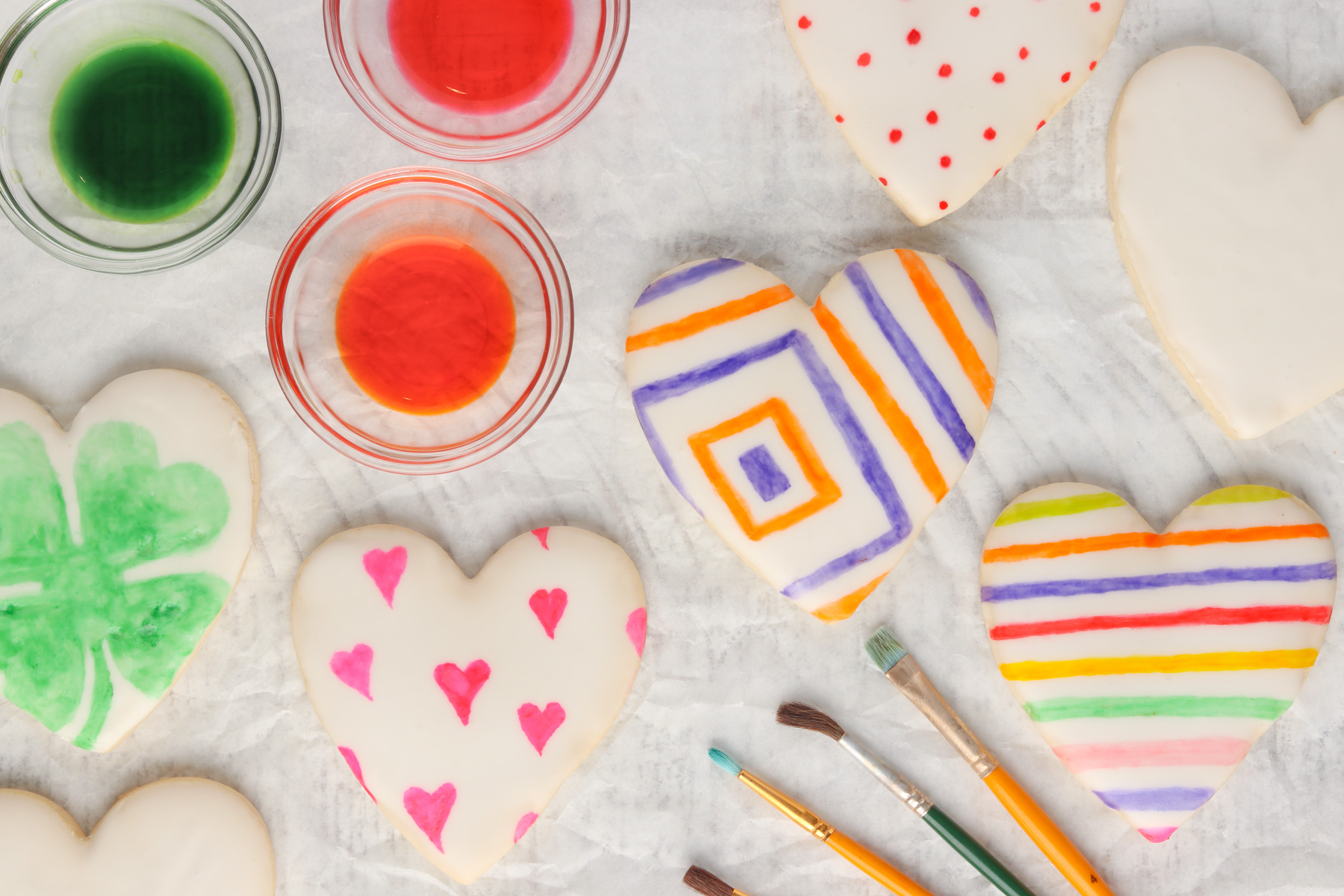 Paint your own cookies samples and green, pink and orange paint created with food gel.