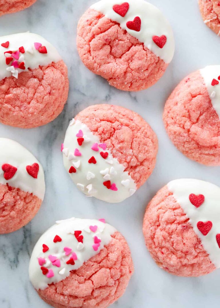 Strawberry Valentine's cookies dipped in white chocolate for a classroom party.