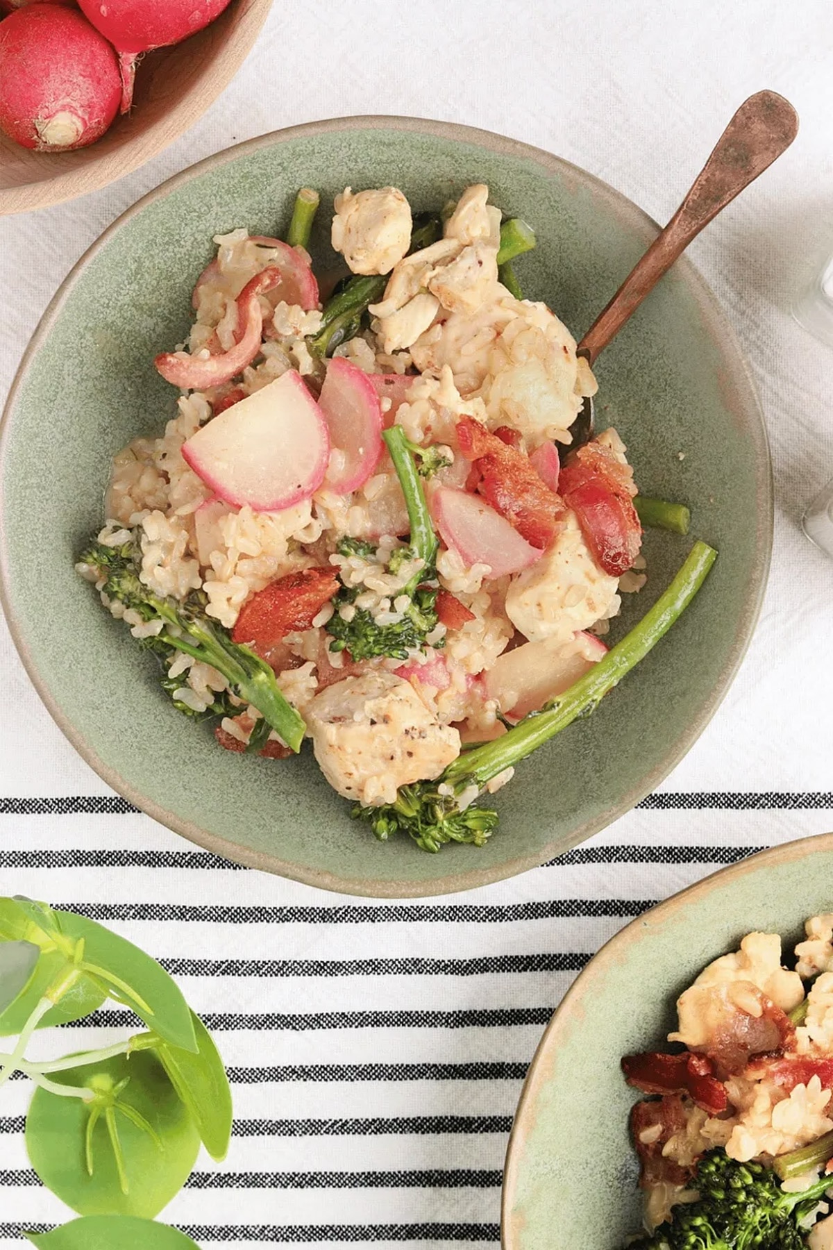 Bacon honey mustard chicken bowl with brown rice, broccolini, radishes and crispy bacon.