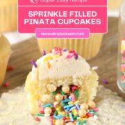 Piñata Cupcakes Filled with Sprinkles cut open with rainbow sprinkles spilling out.
