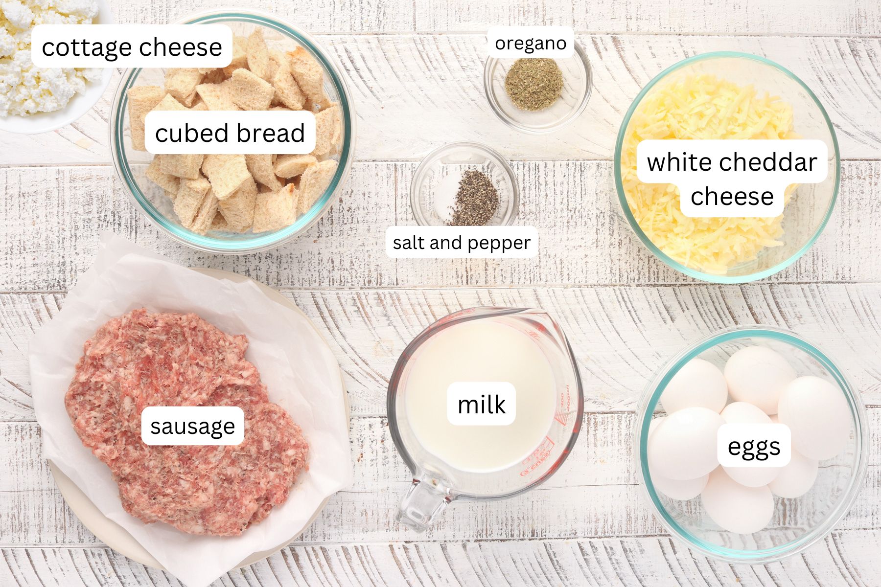 Cottage Cheese Egg Bake Ingredients - cottage cheese, sausage, cheese, bread, milk, eggs and seasoning.