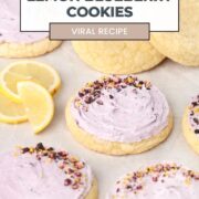 Lemon Blueberry Cookies on a sheet pan with lemons and fresh blueberries.