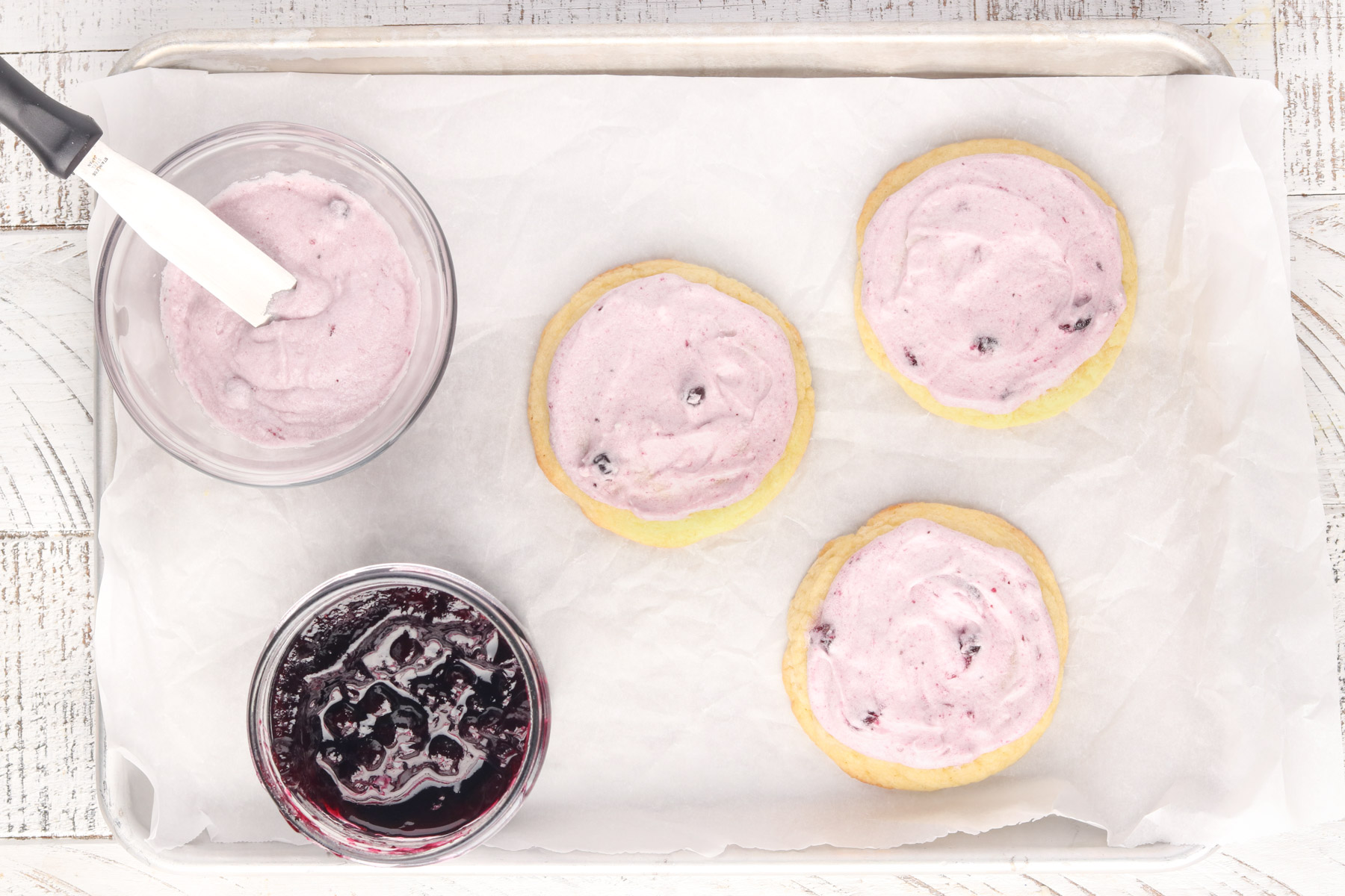 Step 6 - Lemon Blueberry Cookies. Frost the cookies with buttercream icing. 