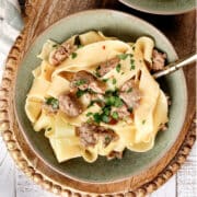 20 Minute Sausage Carbonara on a green plate.